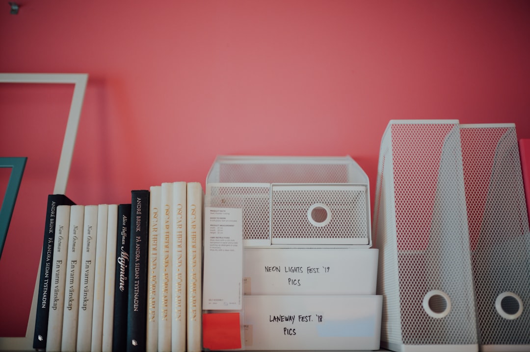 white and gray speaker on books