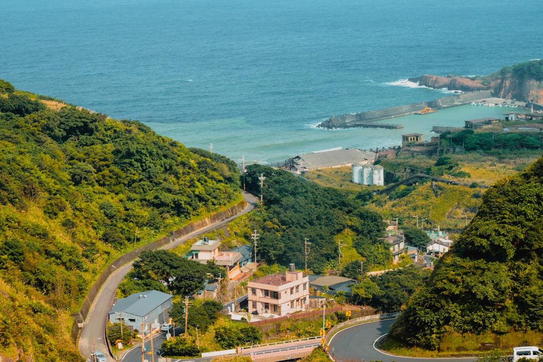 a scenic view of the ocean from a hill