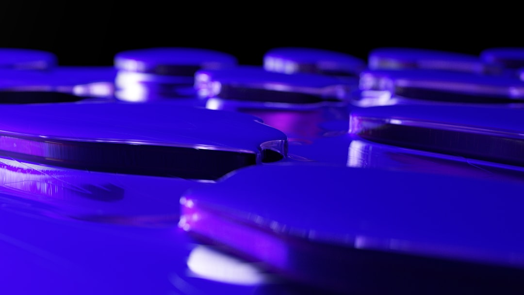 a close up of a purple object with a black background