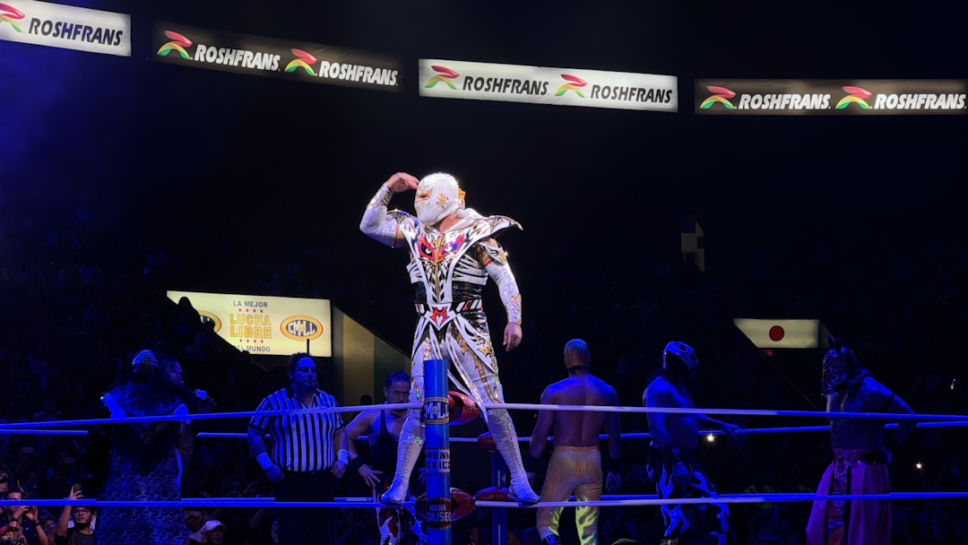 A man standing on top of a wrestling ring