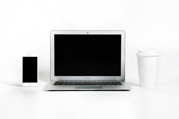 a laptop and a coffee cup