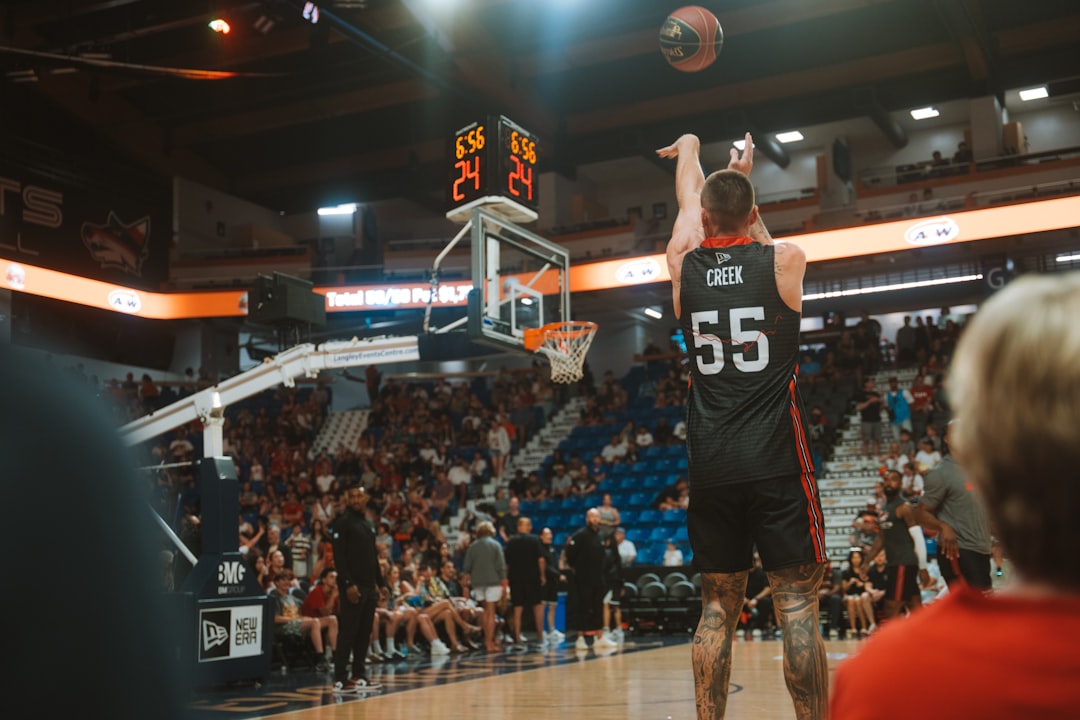 Basketball player shoots the ball during a game.