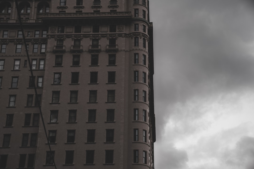 gray concrete building under cloudy sky