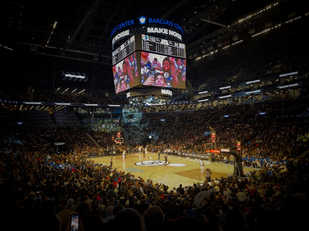 A crowd of people watching a basketball game