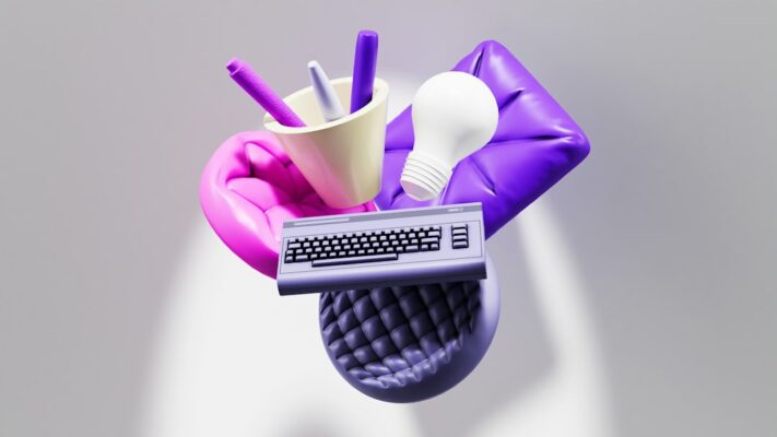 Creative objects including keyboard, lightbulb, and pens.