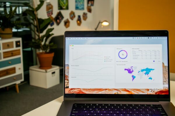 a laptop computer sitting on top of a desk