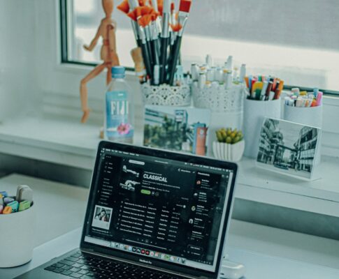 black and silver laptop computer on white table