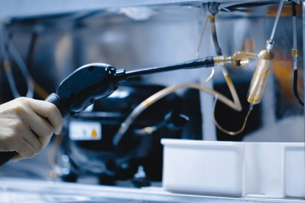 a person is working on a machine with a hose