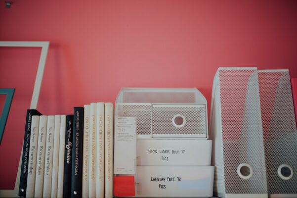 white and gray speaker on books